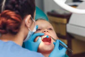 Dentist,Fluoridates,A,Child's,Teeth.,Strengthening,Of,Tooth,Enamel.