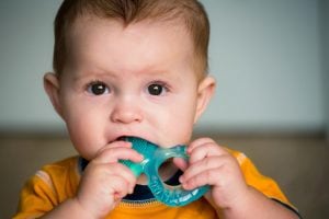 baby using a teething ring