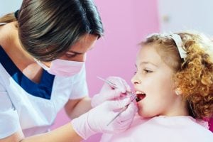 young girl in dentist chair 