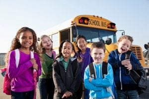 Children in front of the school bus 