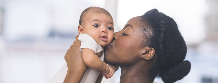 mom kissing baby 1