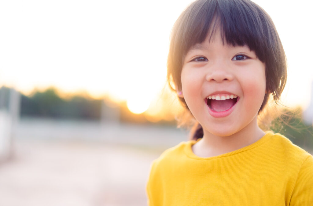 Happy,Little,Asian,Girl,Child,Showing,Front,Teeth,With,Big